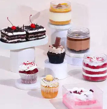 Assorted dessert cups and cupcakes